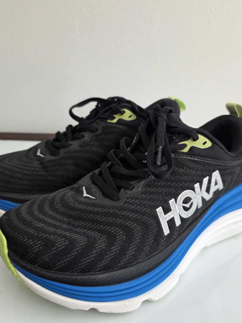 HOKA One One Gaviota Black Running Shoes with Blue & Lime Accents.